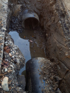 A French drain pipe underground that requires repair