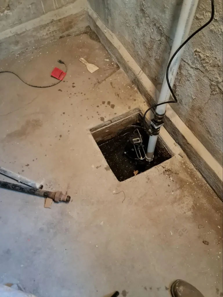 Sump pump installation cost- A sump pump installation in progress in a home in Brooklyn, NY.